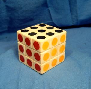 Midsized white  cube with printed colors